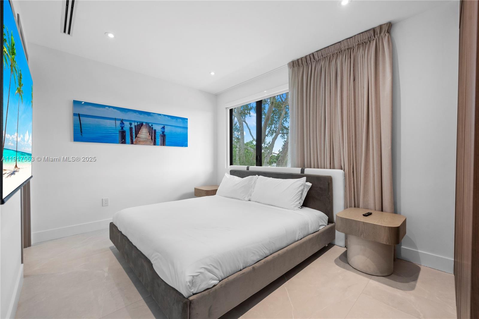 1881 Northeast 196th Terrace Miami, FL 33179 - Photo 74 of 98 a bedroom with a bed and a window