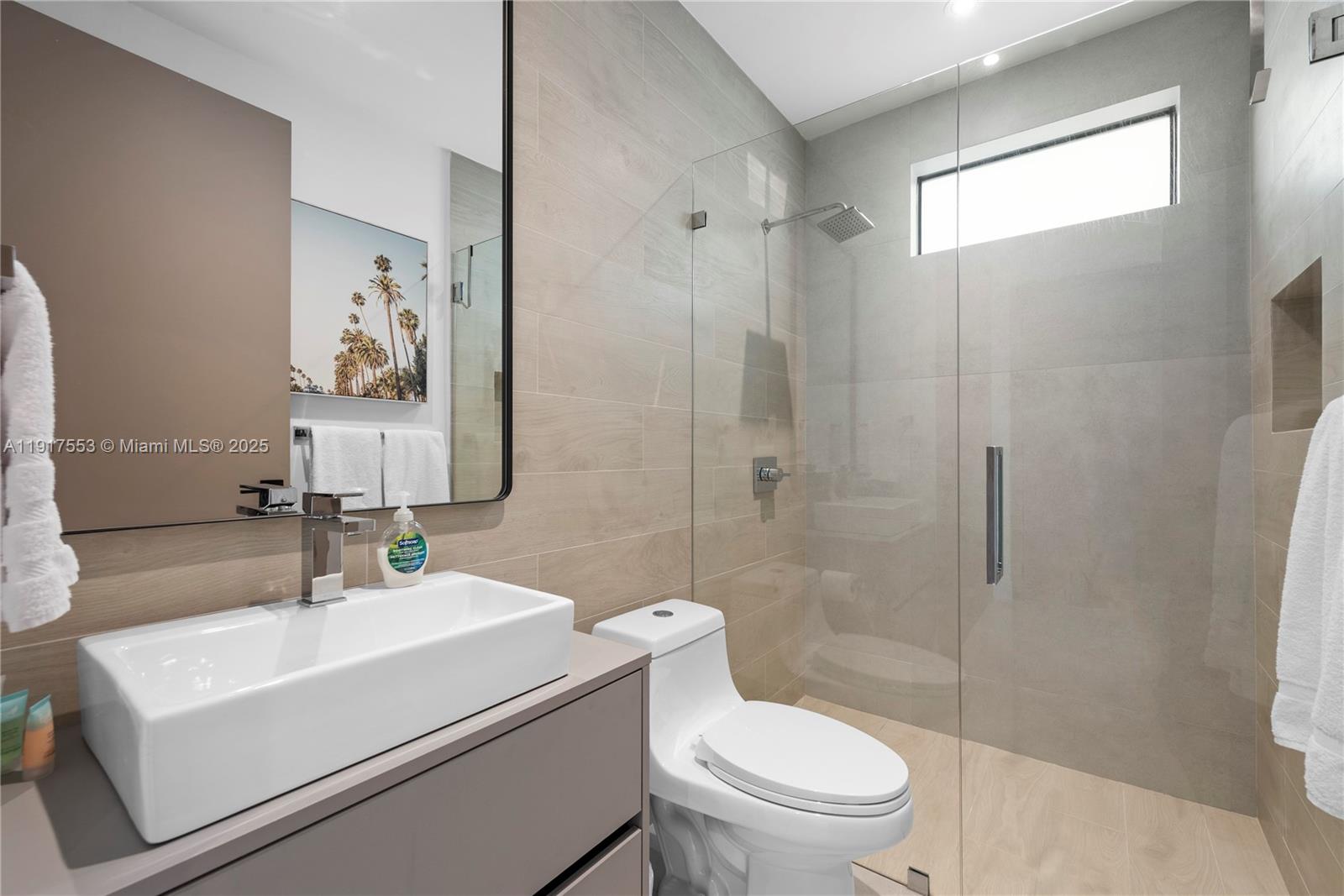 1881 Northeast 196th Terrace Miami, FL 33179 - Photo 79 of 98 a bathroom with a sink toilet and shower