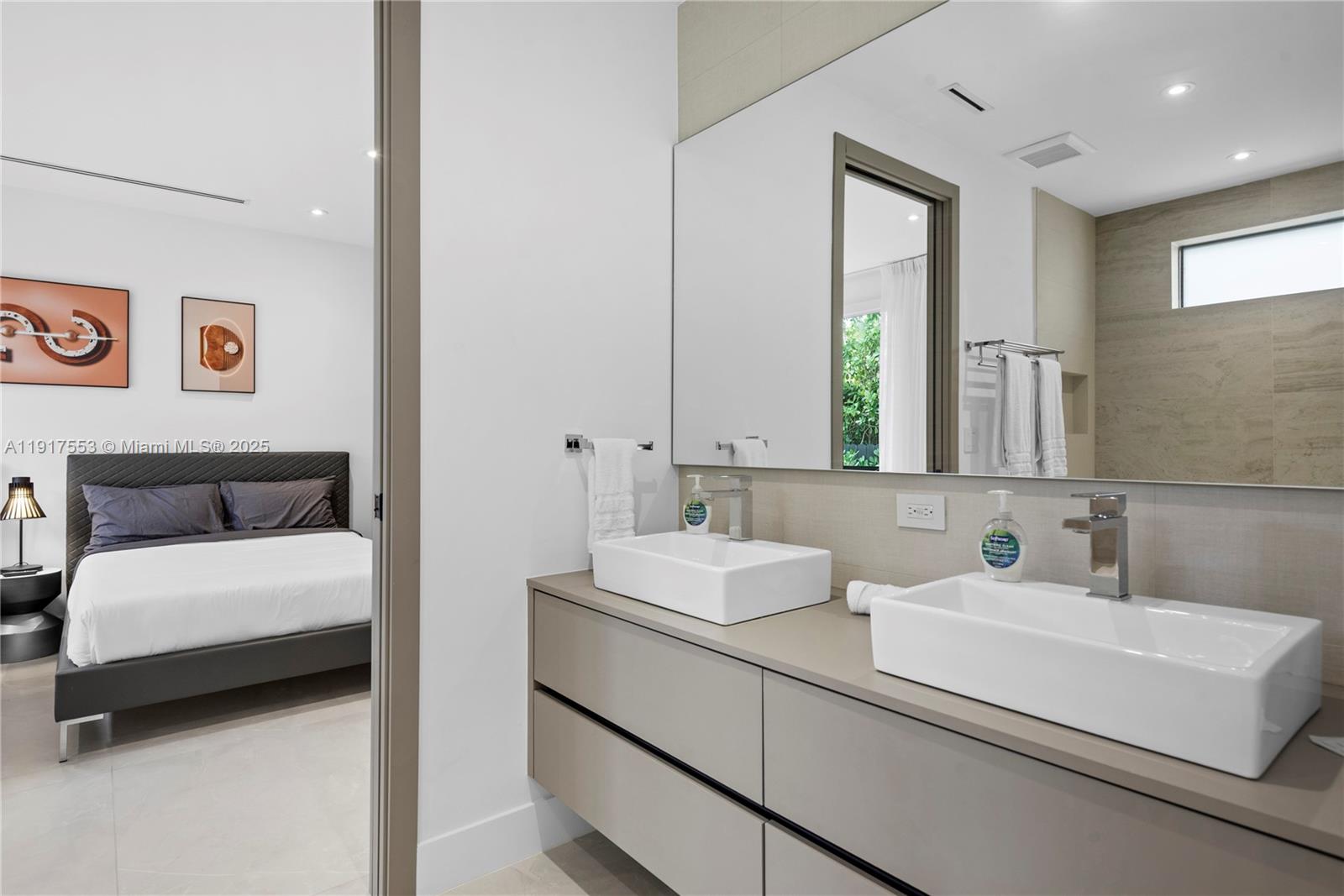 1881 Northeast 196th Terrace Miami, FL 33179 - Photo 85 of 98 a bathroom with a sink and a mirror