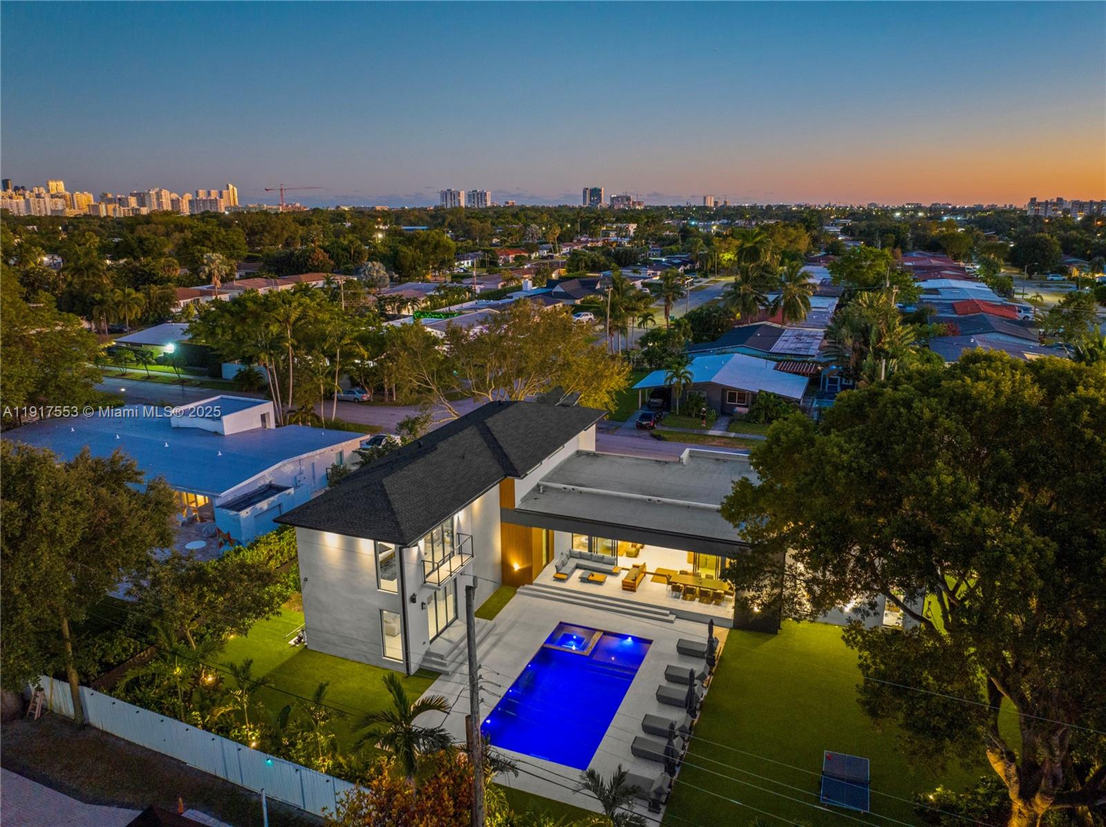 1881 Northeast 196th Terrace Miami, FL 33179 - Photo 92 of 98 an aerial view of residential houses with outdoor space and swimming pool