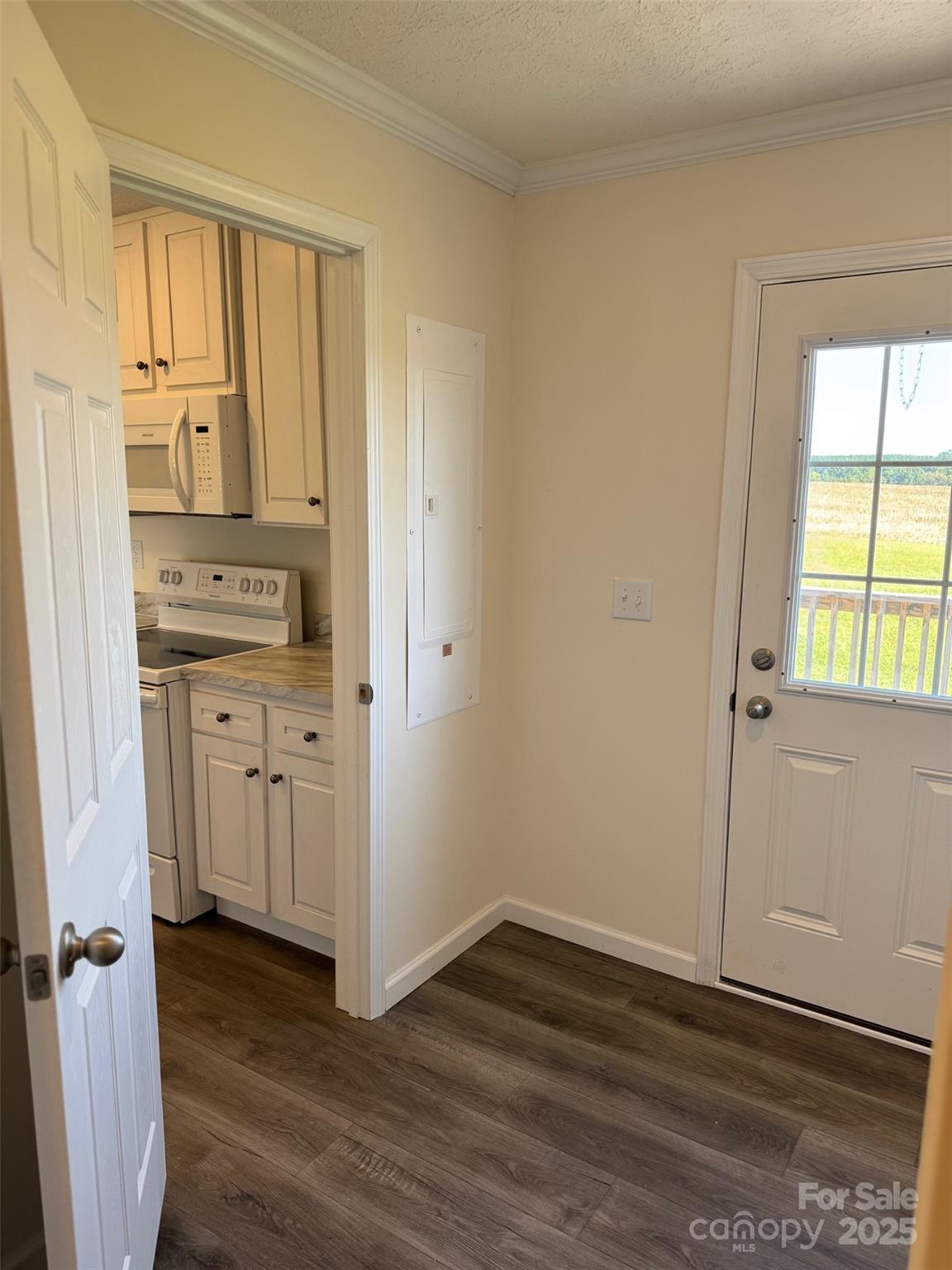 197 Burleson Point Woodleaf, NC 27054 - Photo 11 of 15 an empty room with wooden floor and cabinet