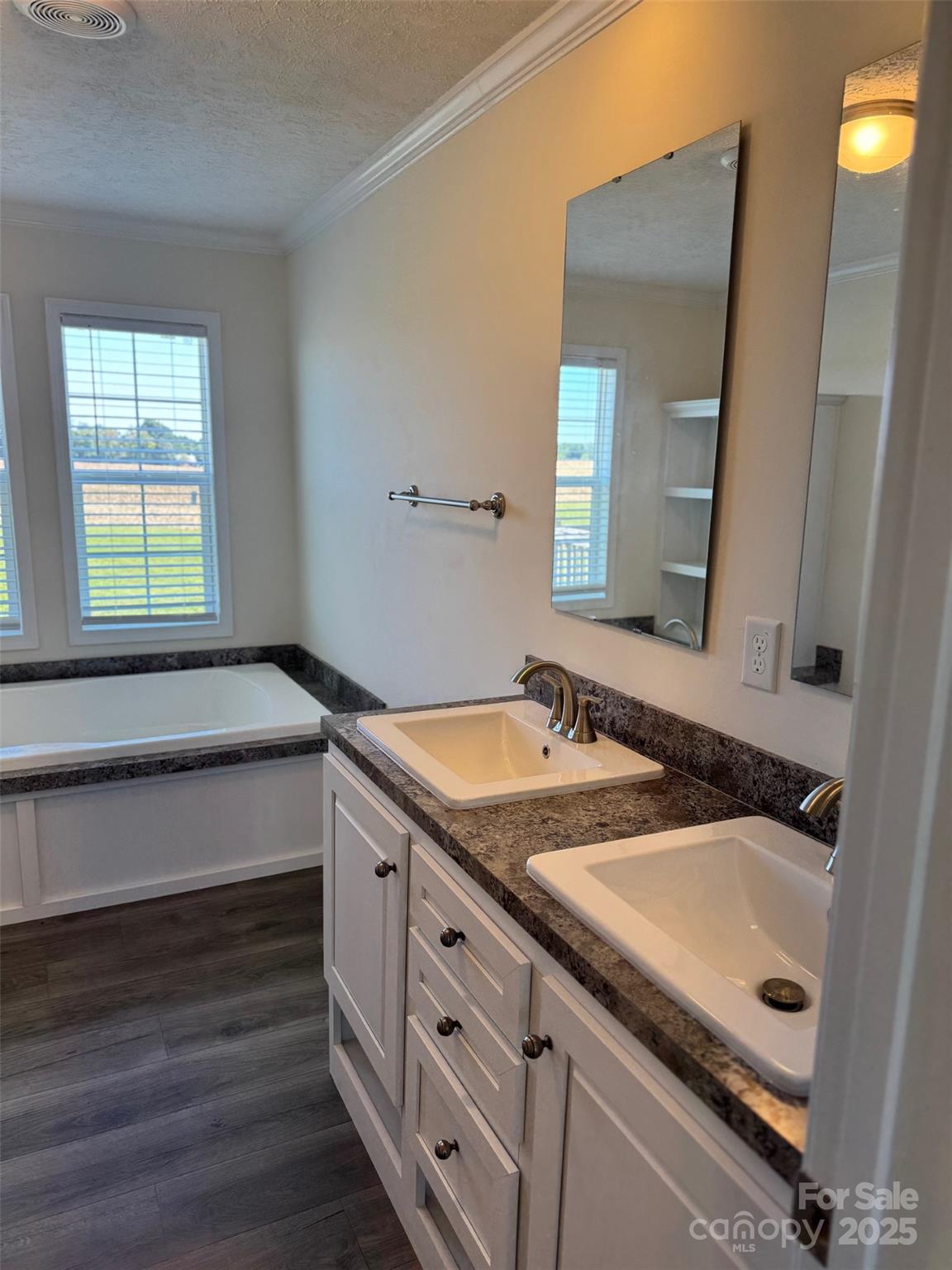 197 Burleson Point Woodleaf, NC 27054 - Photo 15 of 15 a bathroom with a sink and a mirror