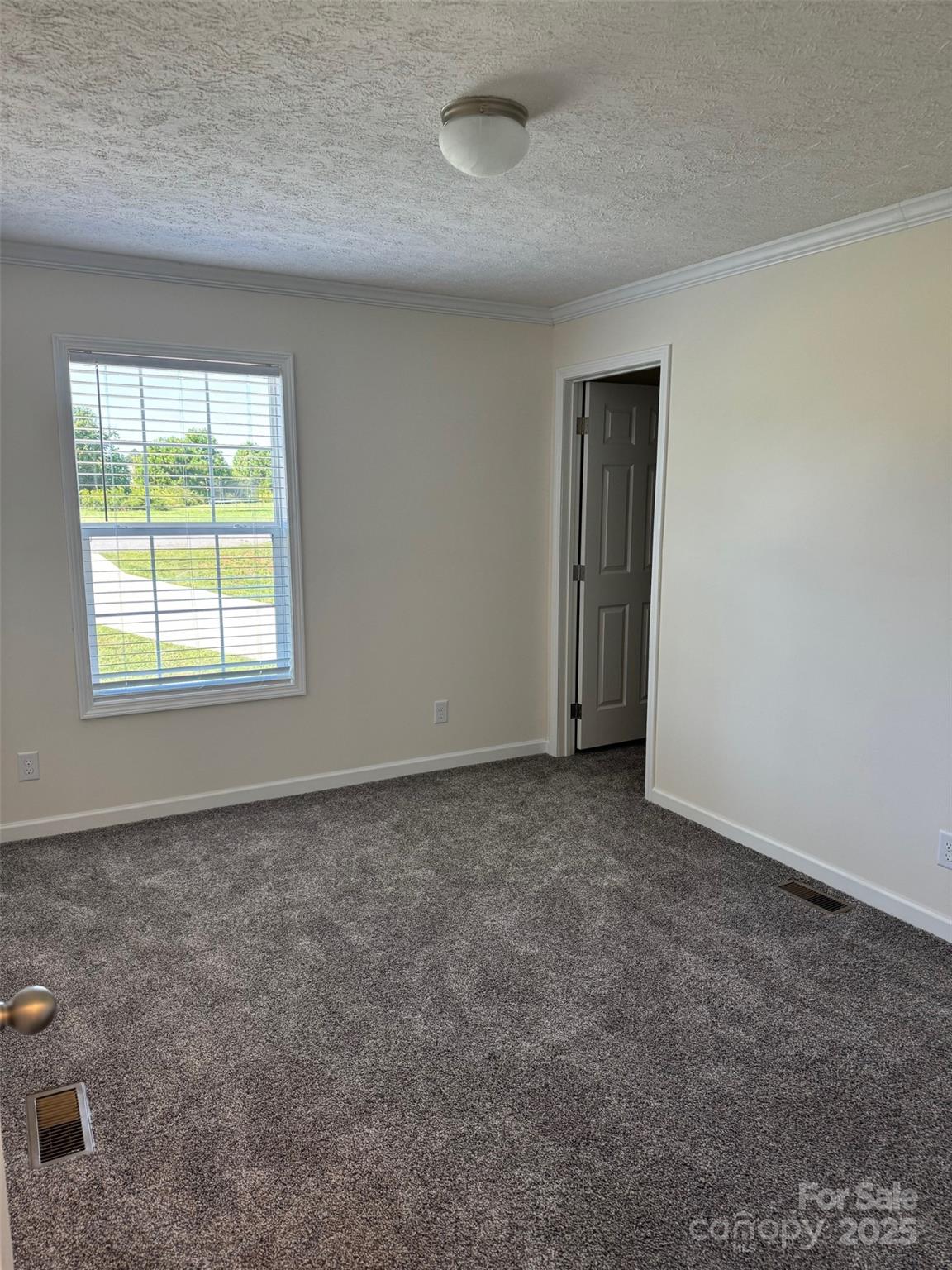 197 Burleson Point Woodleaf, NC 27054 - Photo 6 of 15 an empty room with a window