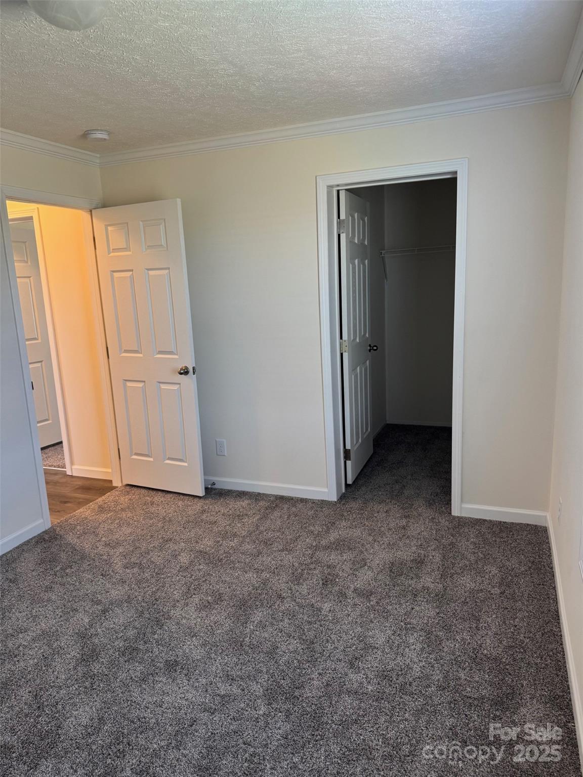 197 Burleson Point Woodleaf, NC 27054 - Photo 7 of 15 an empty room with closet and sliding door