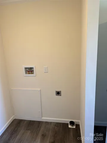 an empty room with wooden floor