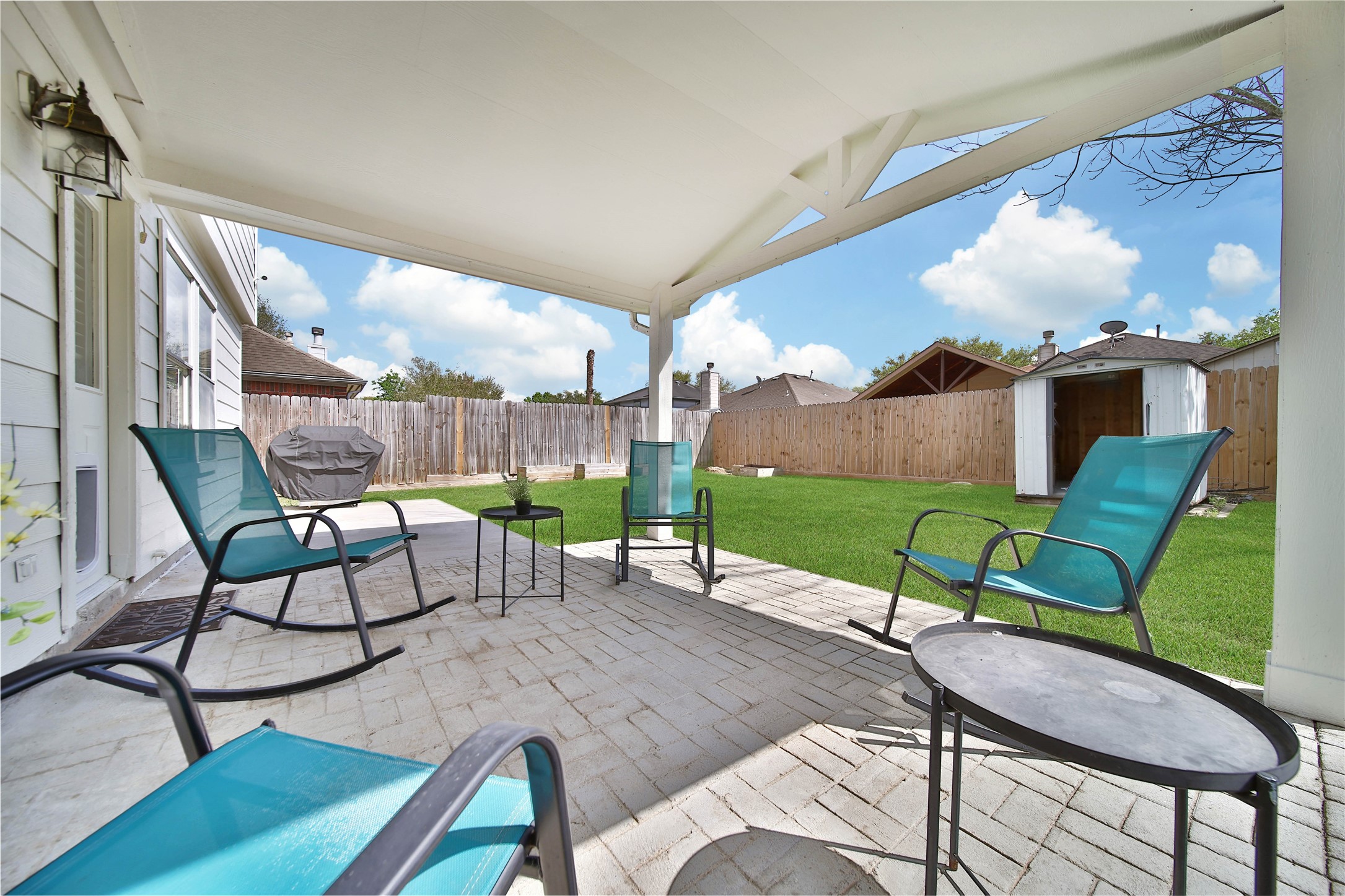 17323 Lobo Trail Houston, TX 77084 - Photo 18 of 21 a view of a chairs and table in backyard