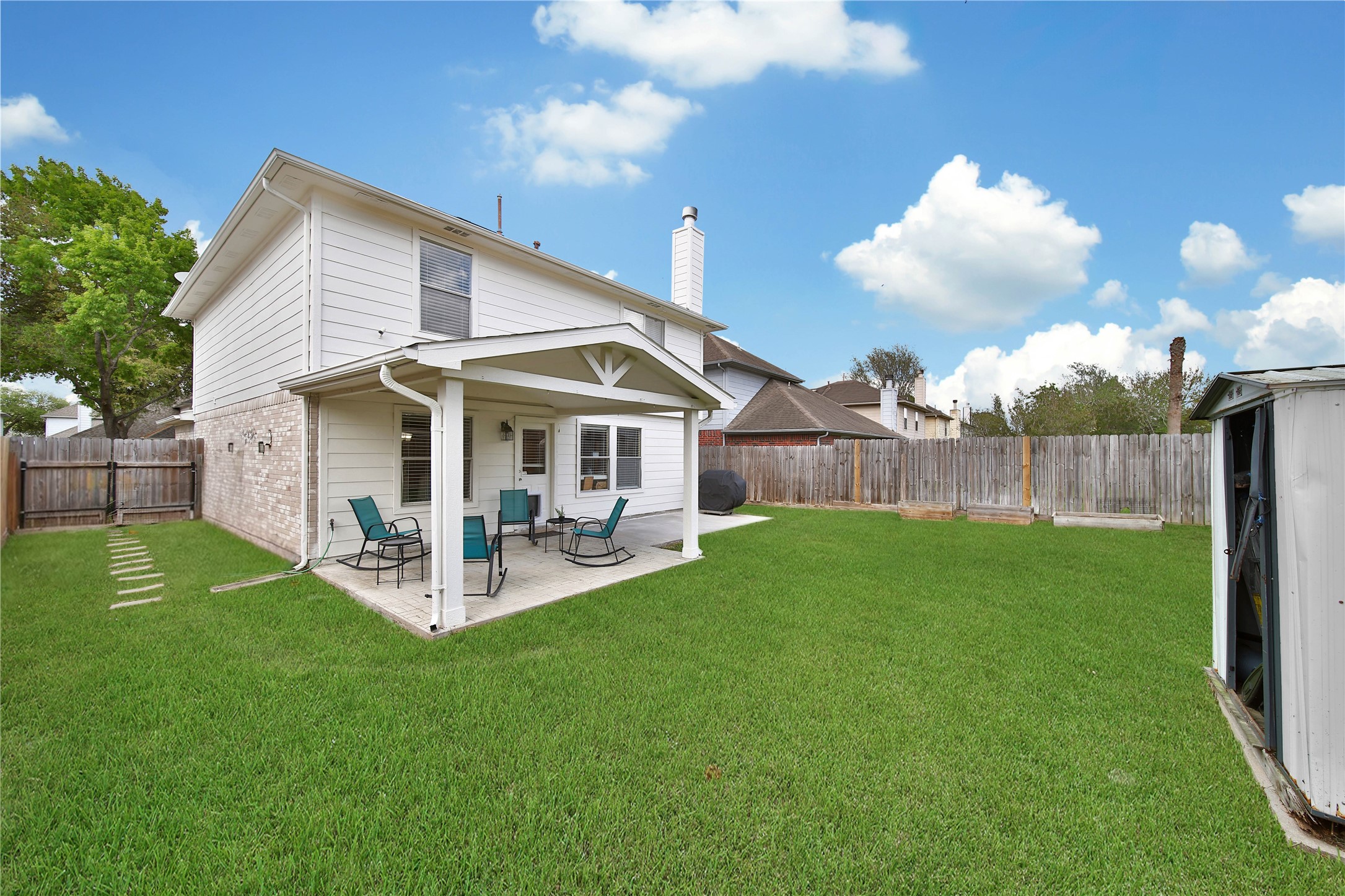 17323 Lobo Trail Houston, TX 77084 - Photo 19 of 21 a view of a house with a yard and porch