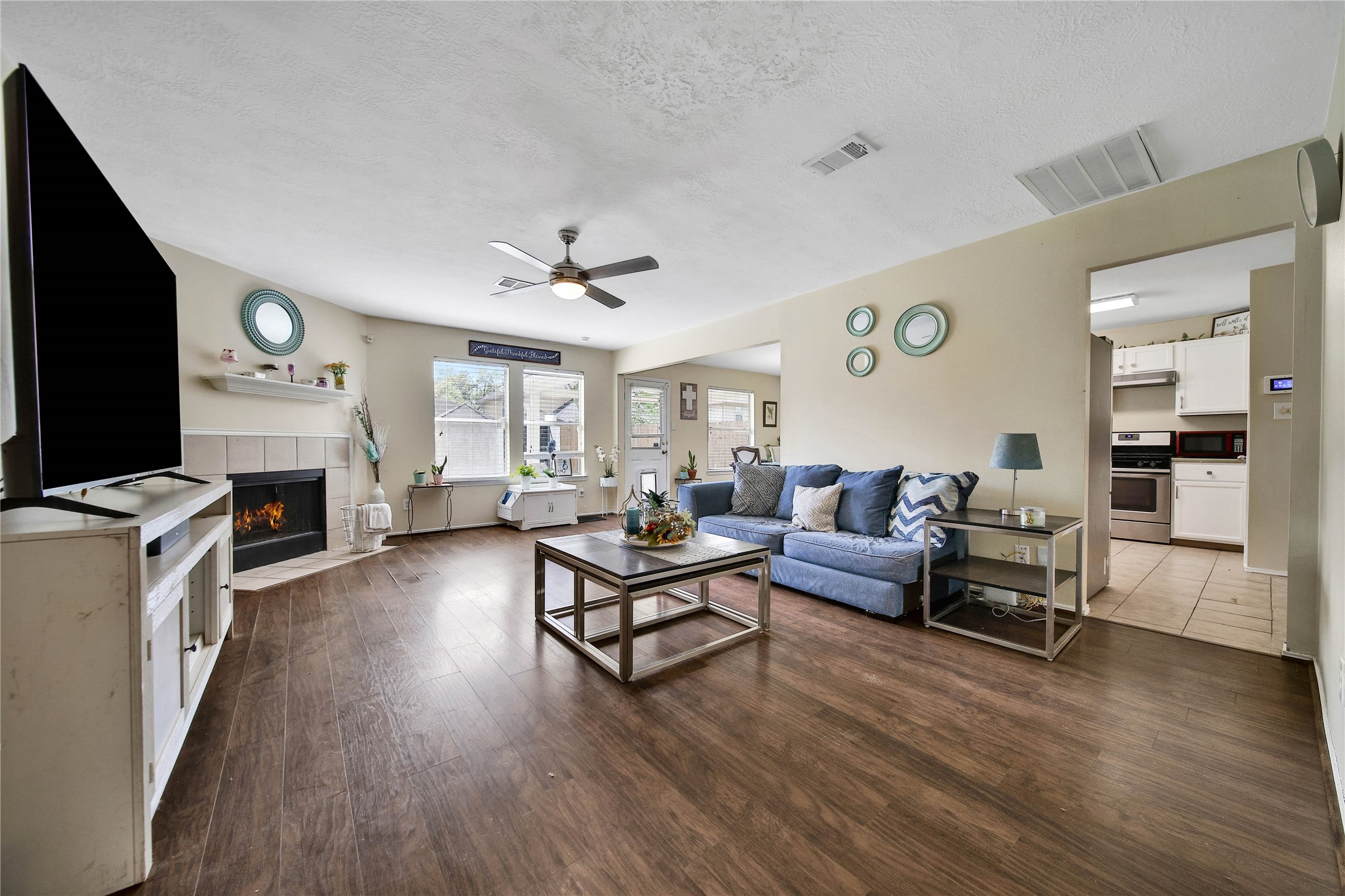 17323 Lobo Trail Houston, TX 77084 - Photo 3 of 21 a living room with furniture and a flat screen tv