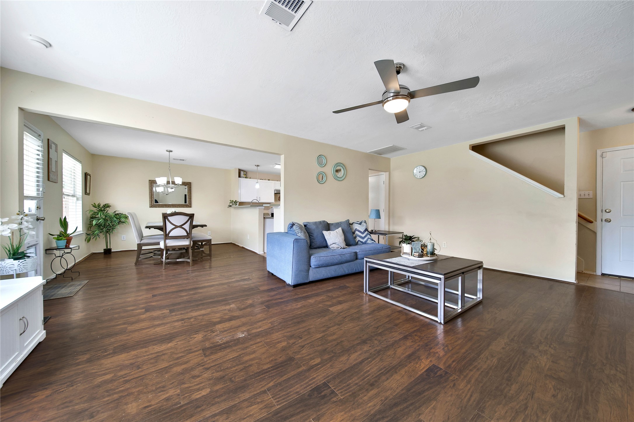 17323 Lobo Trail Houston, TX 77084 - Photo 4 of 21 a living room with furniture ceiling fan and a wooden floor