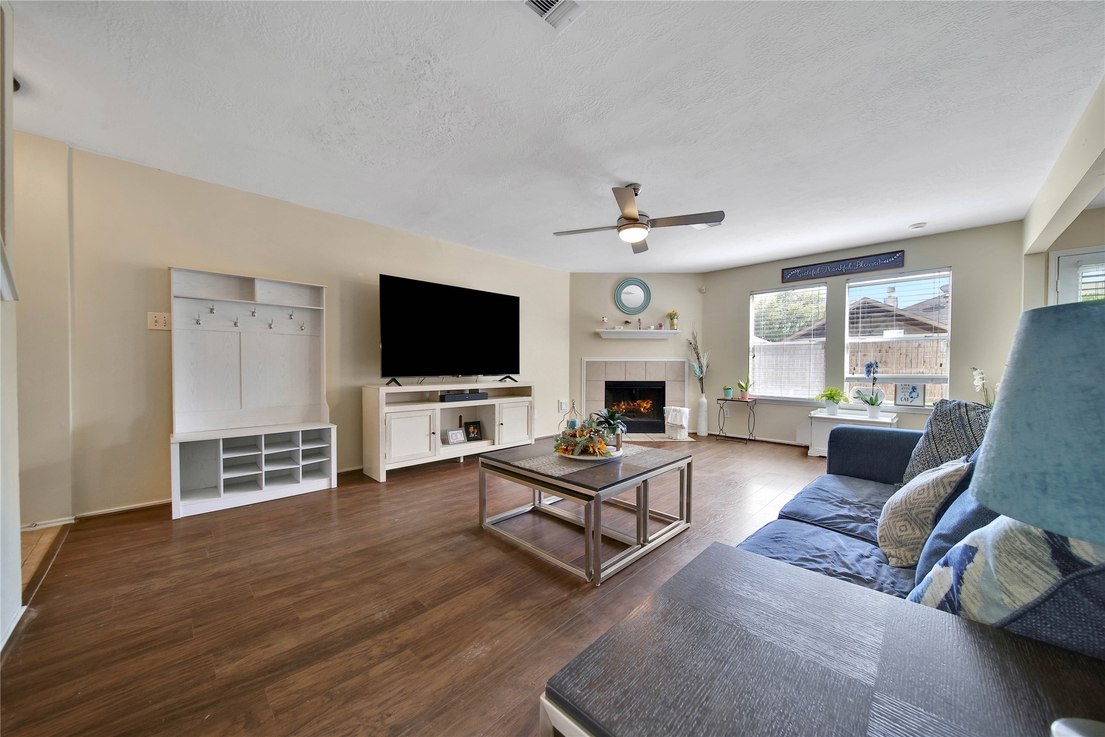 17323 Lobo Trail Houston, TX 77084 - Photo 6 of 21 a living room with furniture and a flat screen tv