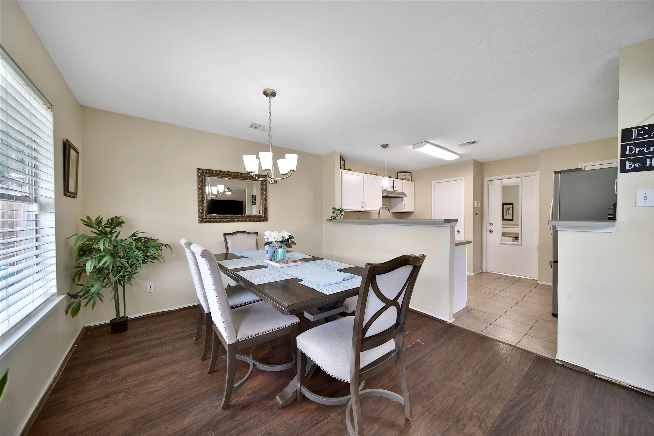 17323 Lobo Trail Houston, TX 77084 - Photo 7 of 21 a view of a dining room with furniture and wooden floor
