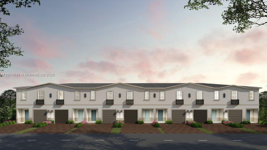 844 Southwest 11th Way Florida City, FL 33034 - Photo 1 of 1 a front view of residential houses with yard