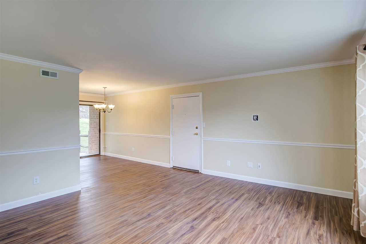 5608 Falls Of Neuse Road, Unit E Raleigh, NC 27609 - Photo 5 of 28 Cut-out to right of door is wired for tv, no hanging, messy wires Living Area