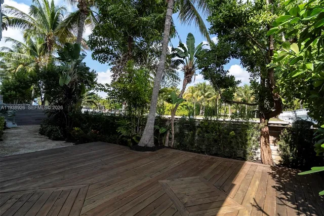 a view of outdoor space with deck and yard