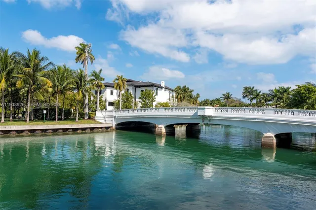 an empty room with wooden floor and sliding glass door