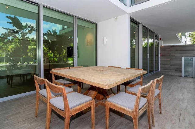 a outdoor dining space with furniture and window