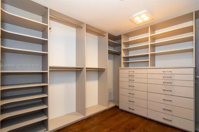 a bathroom with a sink toilet and a mirror