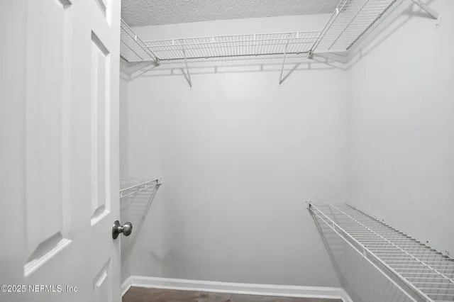 a view of a room with racks on the wall