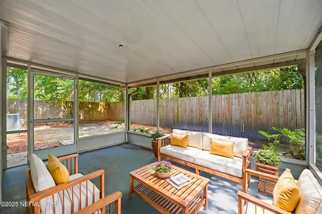 a outdoor living space with furniture and garden view
