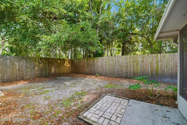 a backyard of a house with lots of green space