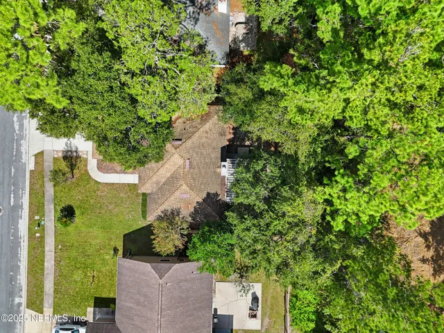 an aerial view of residential house with outdoor space