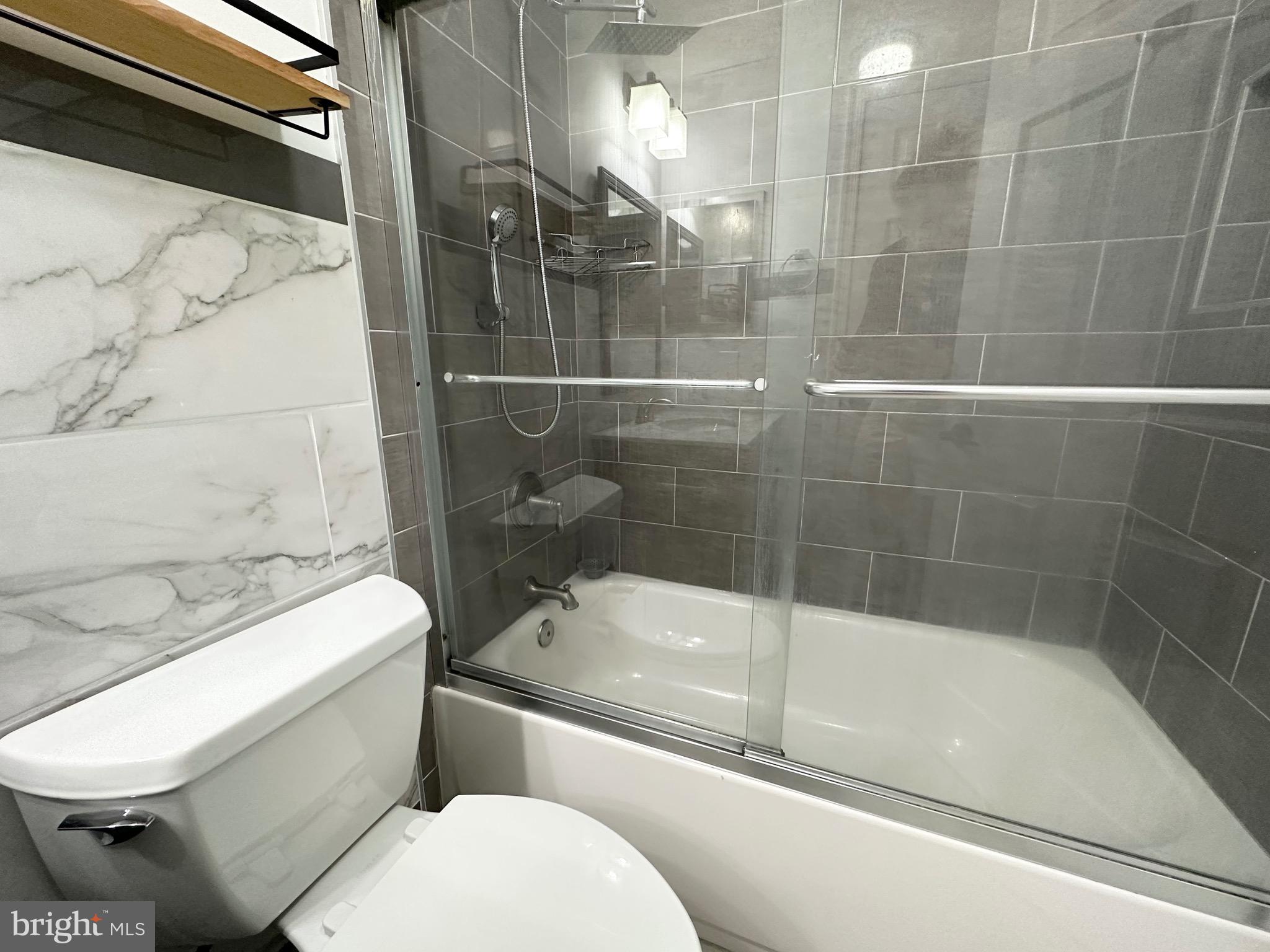 6001 Cloudy April Way Columbia, MD 21044 - Photo 11 of 12 a bathroom with a toilet and a shower