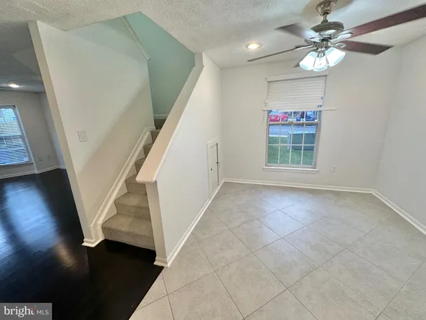 an entryway in a hall with a window