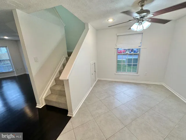 an entryway in a hall with a window