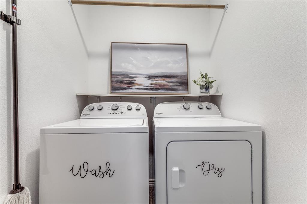7659 Double Bridge Road Mabank, TX 75156 - Photo 12 of 22 Washroom featuring washer and dryer and a textured wall