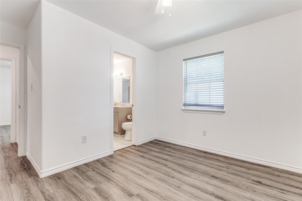 7659 Double Bridge Road Mabank, TX 75156 - Photo 14 of 22 Unfurnished bedroom featuring wood finished floors and connected bathroom