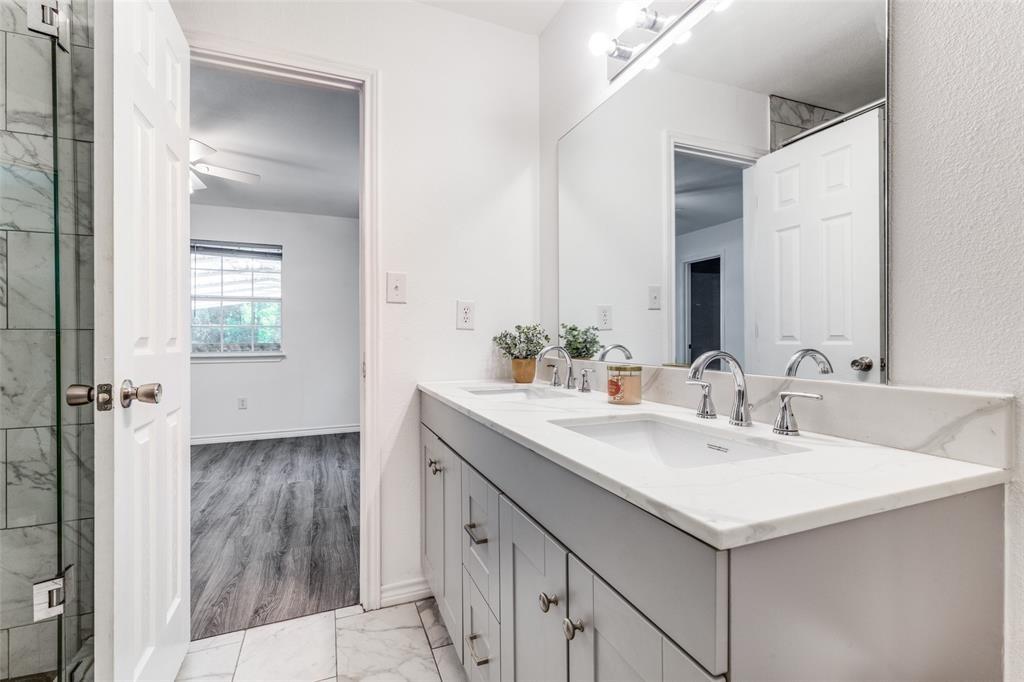 7659 Double Bridge Road Mabank, TX 75156 - Photo 16 of 22 Full bath with marble look tiles and double vanity