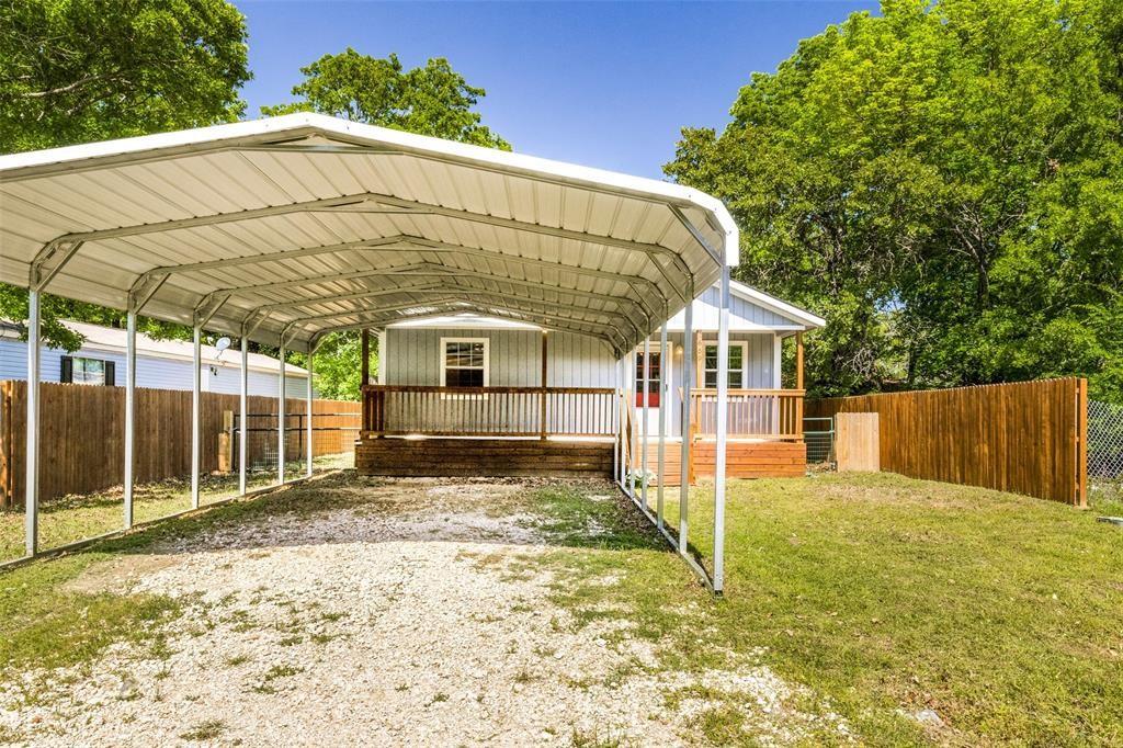 7659 Double Bridge Road Mabank, TX 75156 - Photo 2 of 22 View of parking with a detached carport and driveway