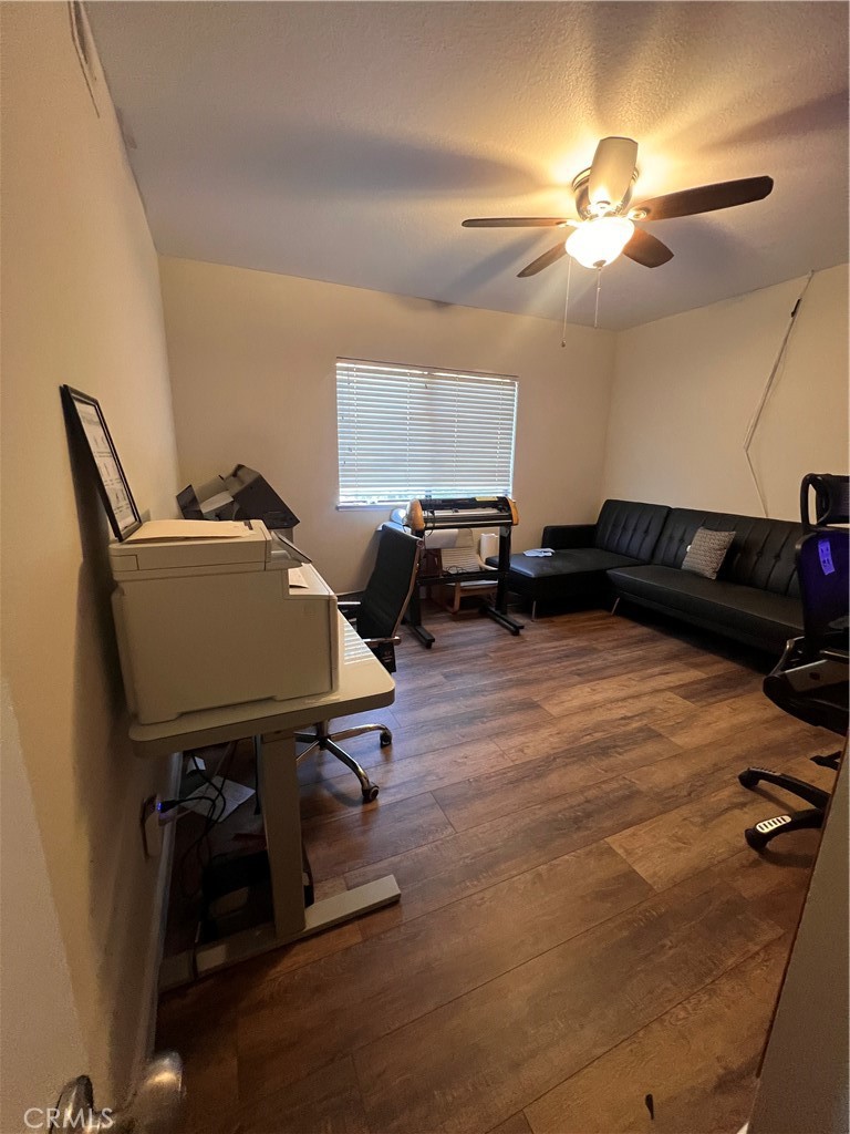 7158 Golden Vale Drive Riverside, CA 92506 - Photo 11 of 36 a living room with furniture and a chandelier