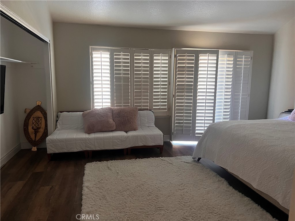 7158 Golden Vale Drive Riverside, CA 92506 - Photo 19 of 36 a bedroom with a bed a couch and a window