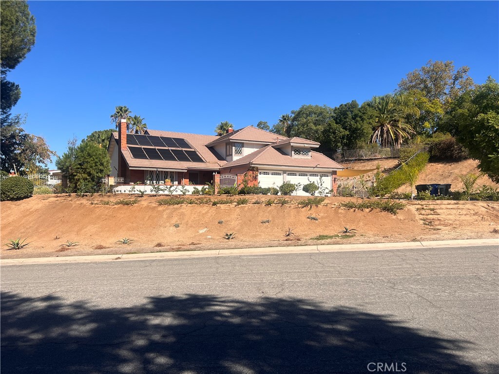 7158 Golden Vale Drive Riverside, CA 92506 - Photo 2 of 36 a view of a building with a ocean beach