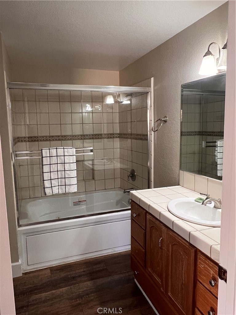 7158 Golden Vale Drive Riverside, CA 92506 - Photo 22 of 36 a bathroom with a sink a toilet and shower