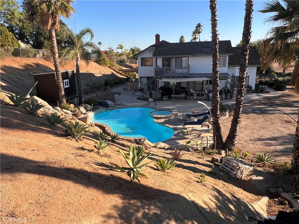 7158 Golden Vale Drive Riverside, CA 92506 - Photo 29 of 36 a view of a house with backyard water fountain and sitting area