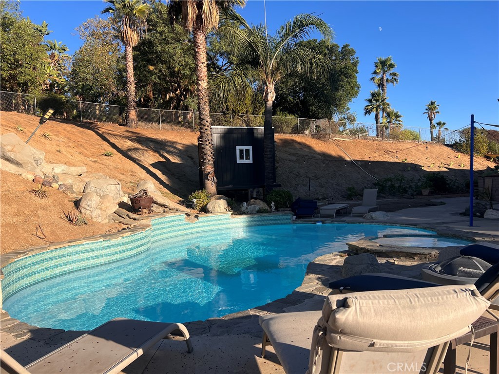 7158 Golden Vale Drive Riverside, CA 92506 - Photo 32 of 36 a backyard of a house with yard and outdoor seating