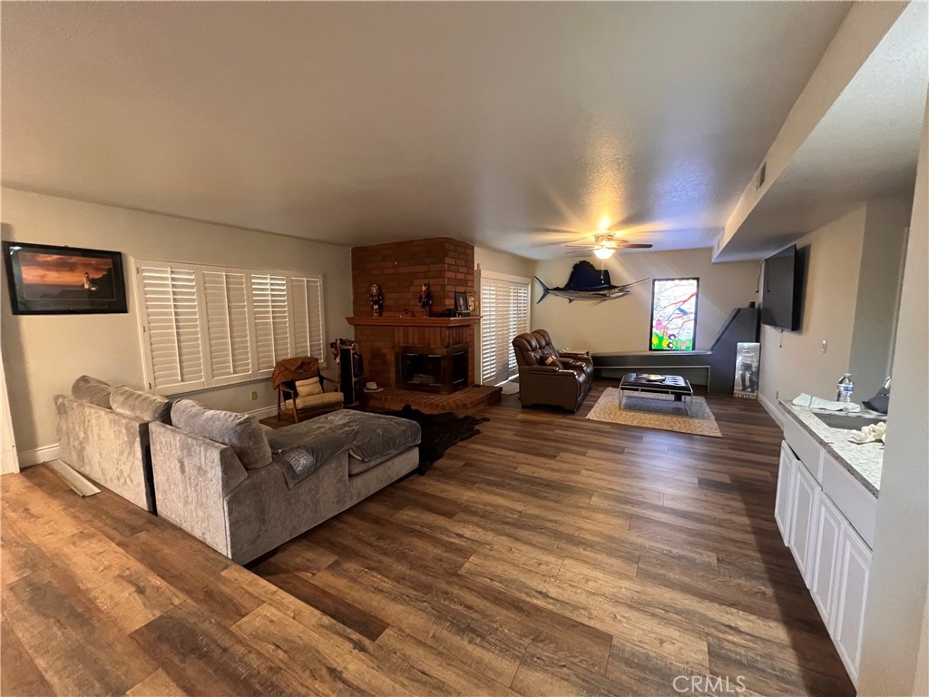 7158 Golden Vale Drive Riverside, CA 92506 - Photo 10 of 36 a living room with furniture and a wooden floor