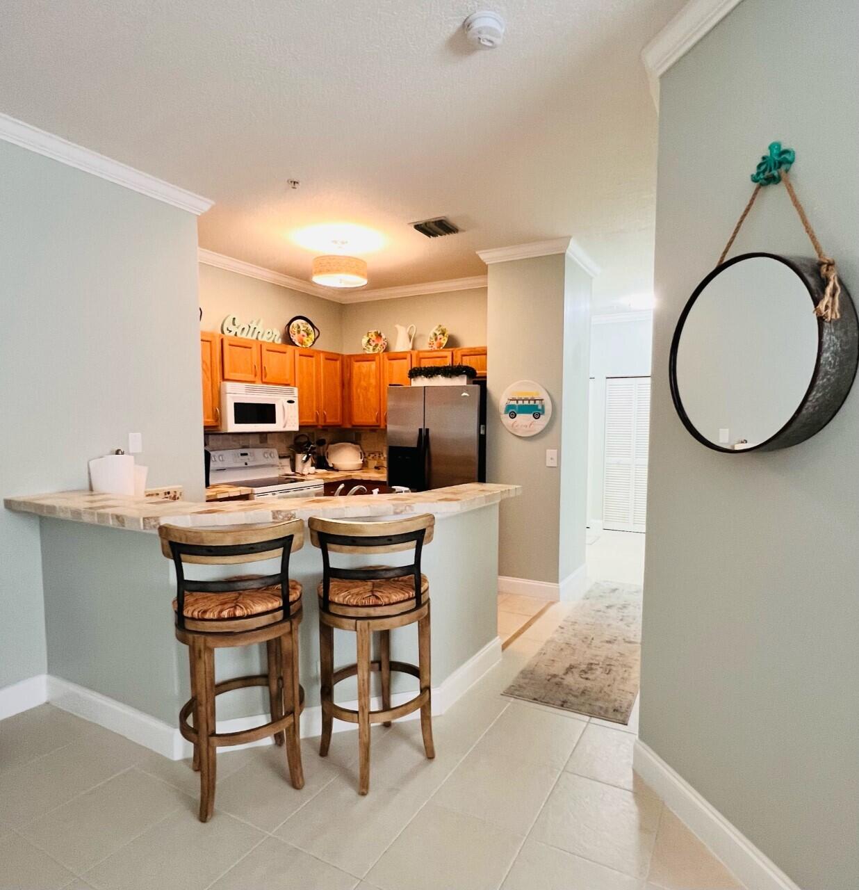 115 Lighthouse Circle, Unit B Tequesta, FL 33469 - Photo 9 of 19 kitchen view from living room
