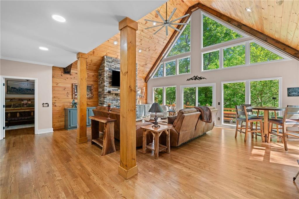 a living room with furniture and a floor to ceiling window