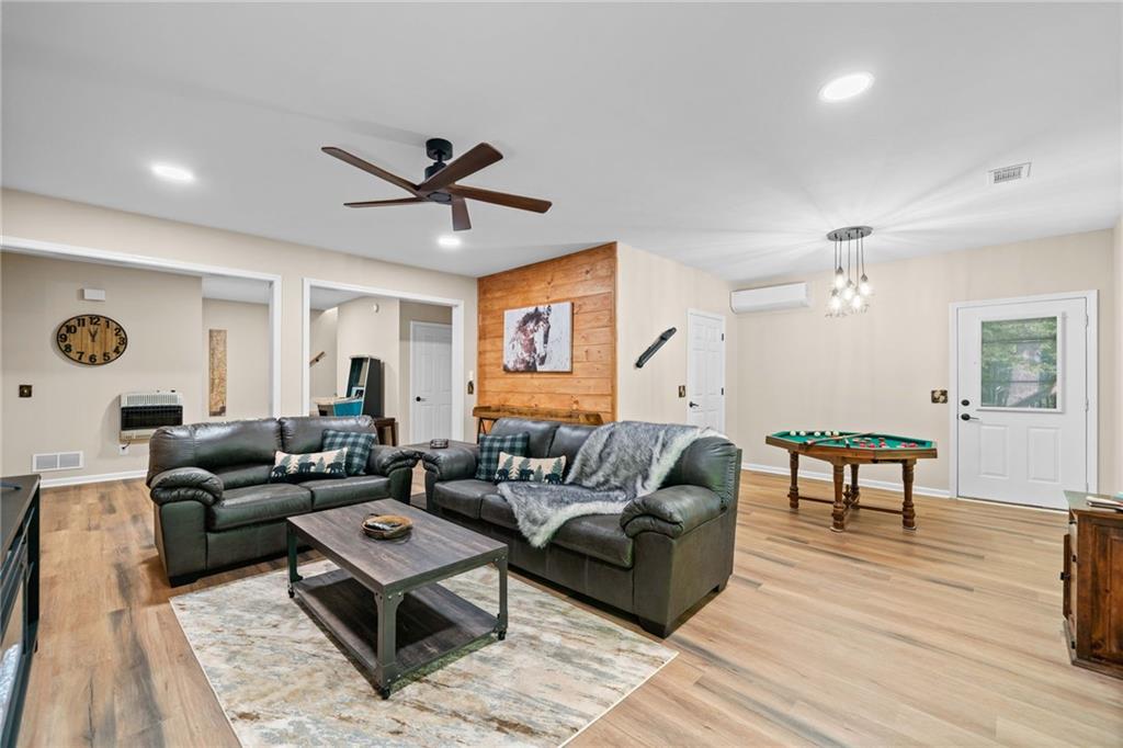 816 Alpine Drive Jasper, GA 30143 - Photo 17 of 51 a living room with furniture and a wooden floor