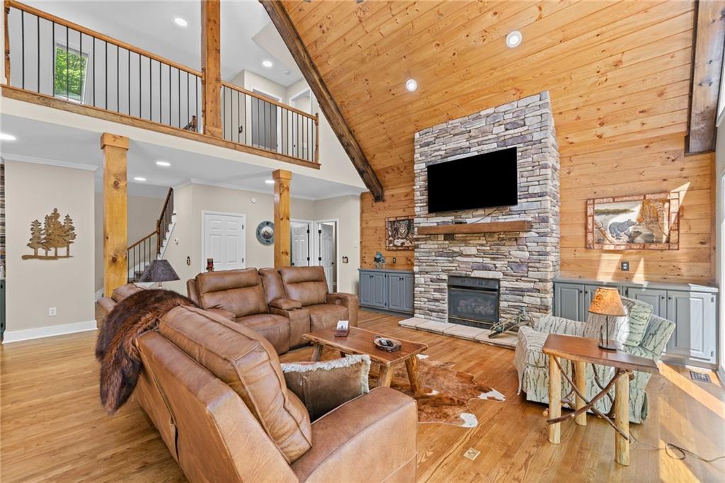 816 Alpine Drive Jasper, GA 30143 - Photo 2 of 51 a living room with furniture a flat screen tv and a fireplace