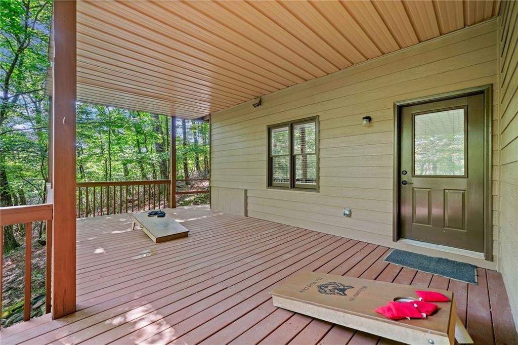 816 Alpine Drive Jasper, GA 30143 - Photo 21 of 51 a bedroom with furniture window and wooden floor