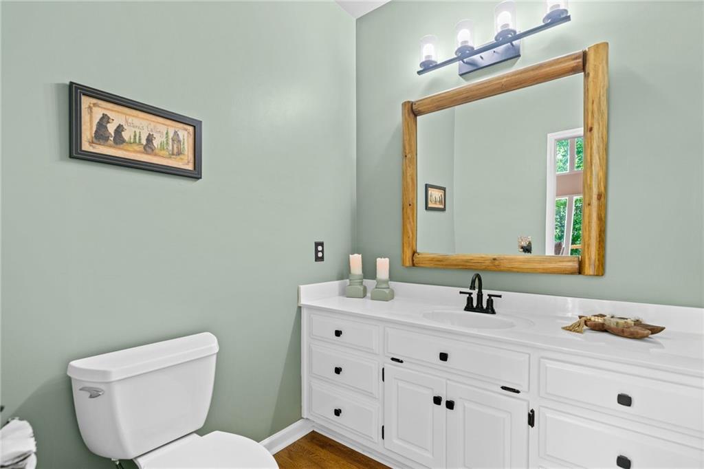 816 Alpine Drive Jasper, GA 30143 - Photo 30 of 51 a bathroom with a toilet sink and mirror