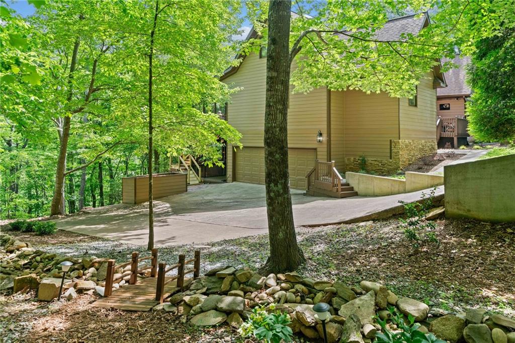 816 Alpine Drive Jasper, GA 30143 - Photo 32 of 51 a front view of a house with garden