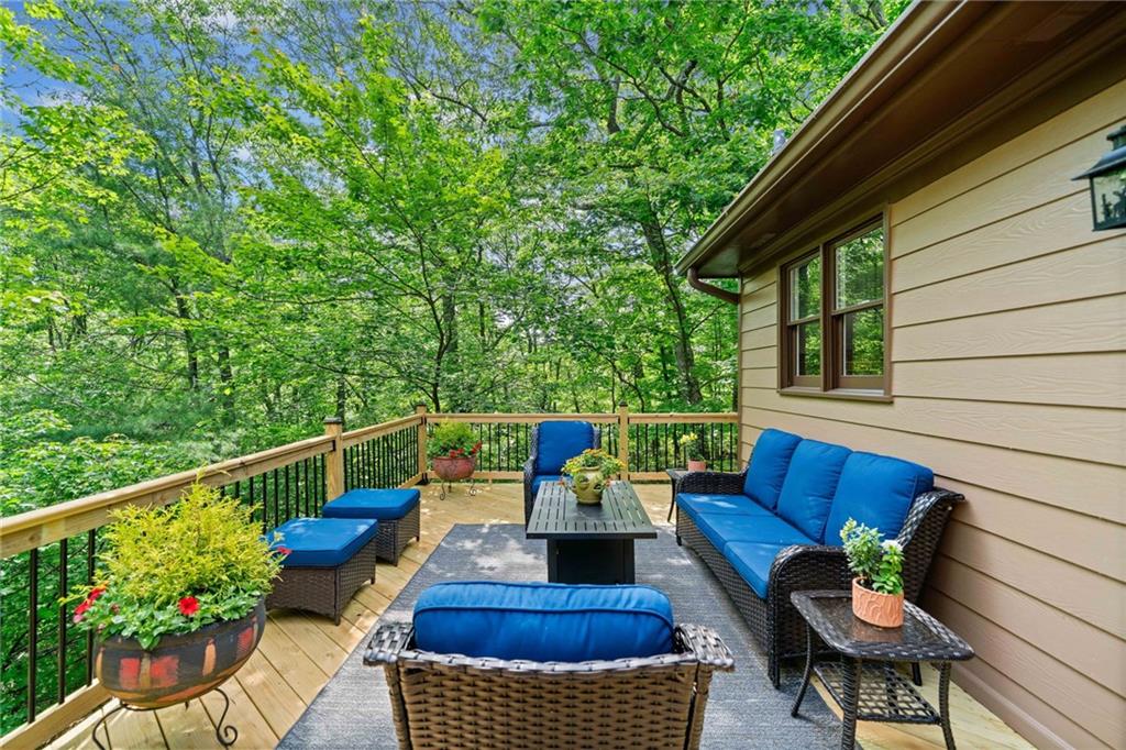 816 Alpine Drive Jasper, GA 30143 - Photo 6 of 51 a balcony with wooden floor and outdoor seating