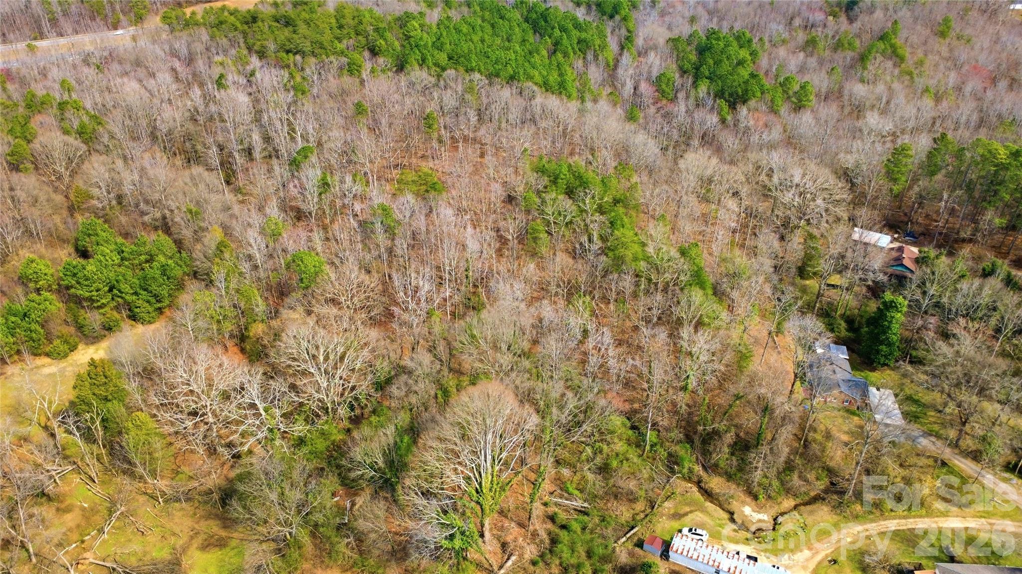 530-2 Waco Road Kings Mountain, NC 28086 - Photo 17 of 27 a view of a yard with plants and wooden fence