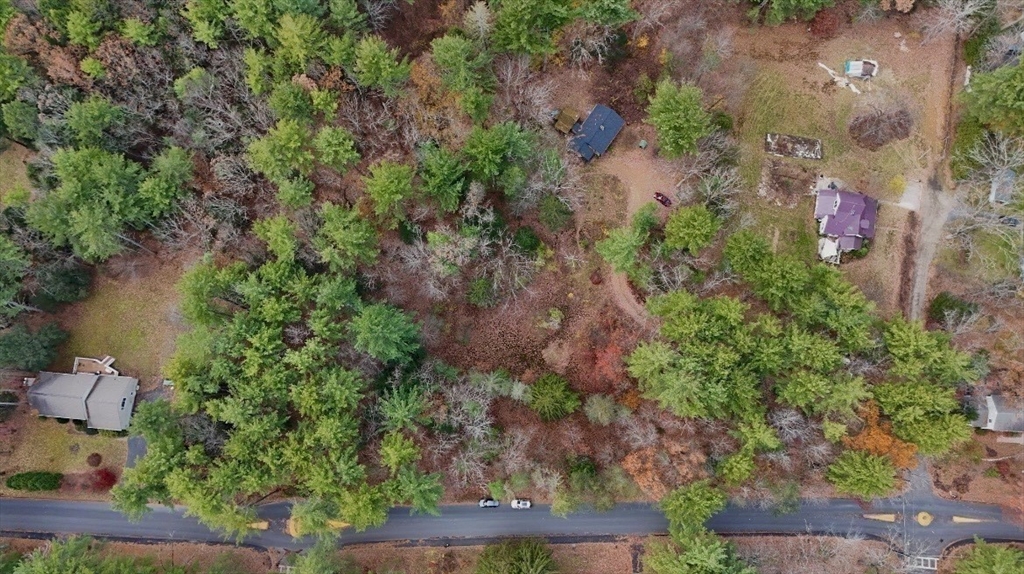 0 Heatherstone Road Amherst, MA 01002 - Photo 3 of 11 an aerial view of a house with a yard and lake view