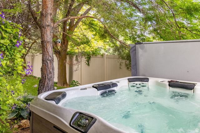 288 525 South Providence, UT 84332 - Photo 50 of 71 Outdoor spa with a gray composite exterior, integrated control panel, and multiple seating areas